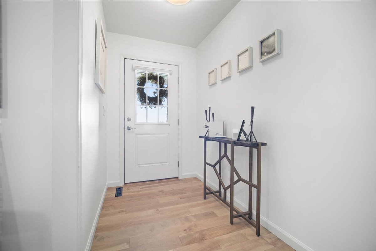 1423 Pine Forest Drive Normal, IL 61761 - Photo 20 of 23 a view of an entryway with wooden floor