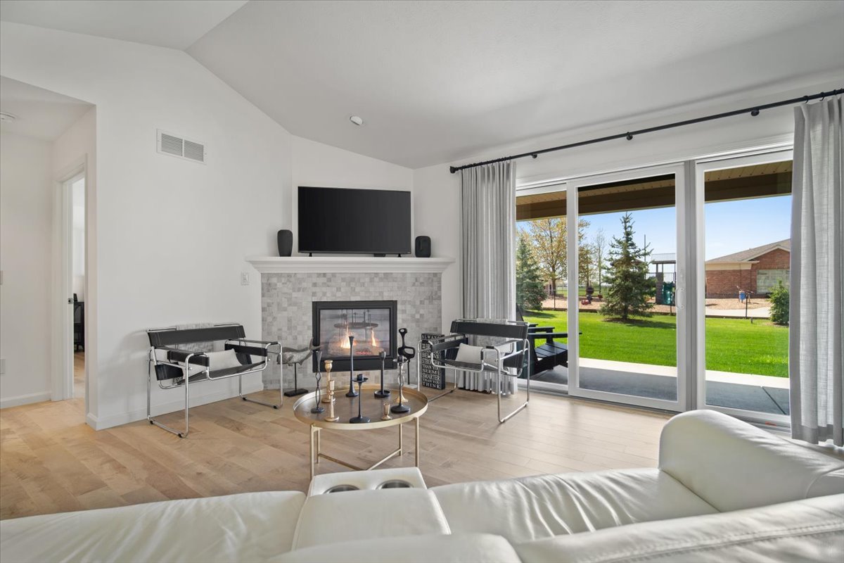 1423 Pine Forest Drive Normal, IL 61761 - Photo 4 of 23 a living room with furniture fireplace and a large window