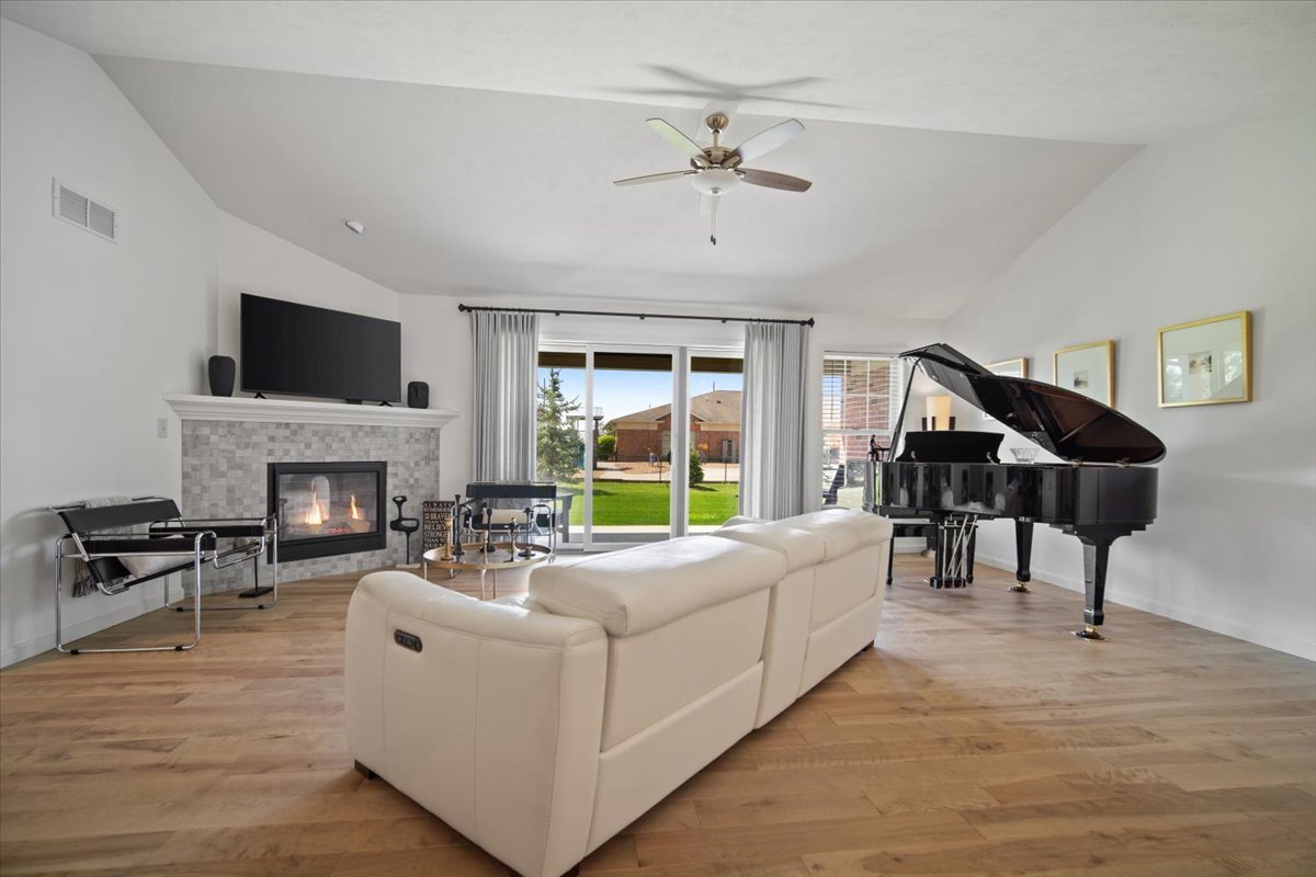 1423 Pine Forest Drive Normal, IL 61761 - Photo 9 of 23 a living room with furniture fireplace and a flat screen tv