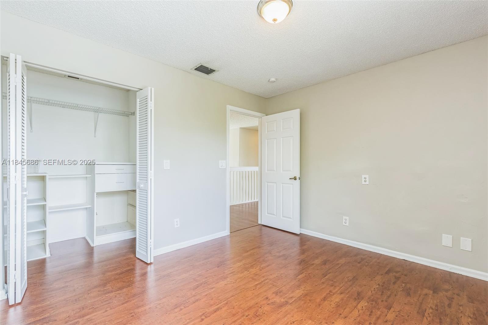 18091 Southwest 22nd Street Miramar, FL 33029 - Photo 12 of 41 a view of empty room with wooden floor