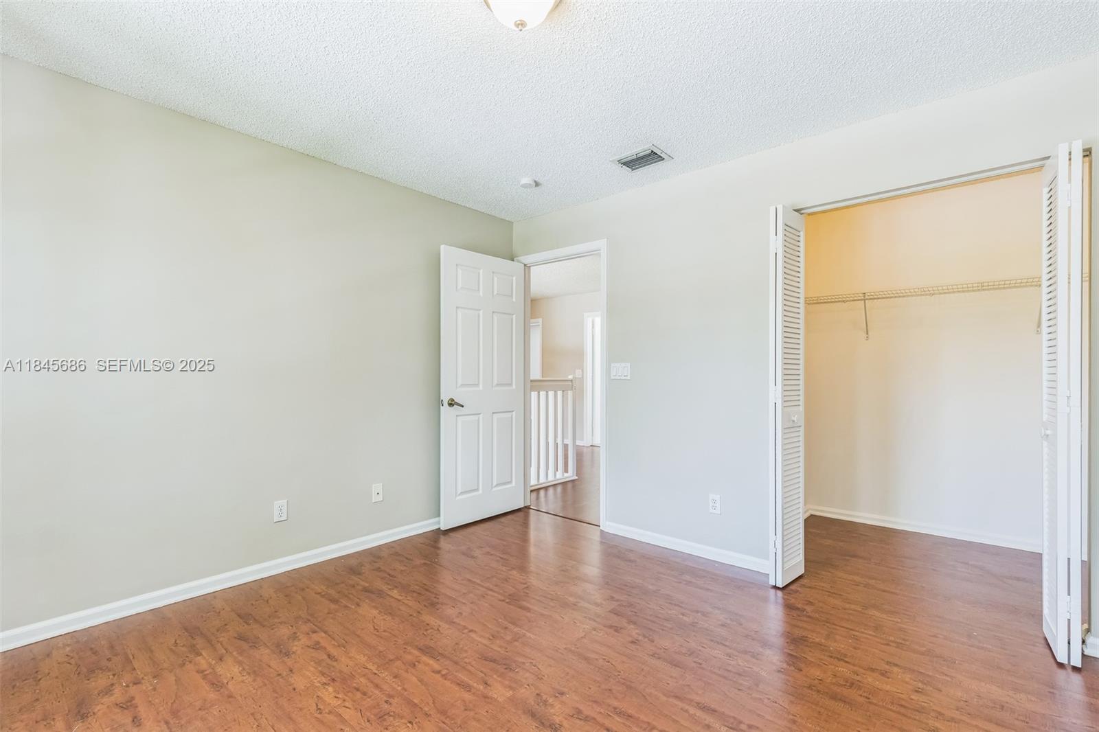 18091 Southwest 22nd Street Miramar, FL 33029 - Photo 13 of 41 a view of an empty room with wooden floor