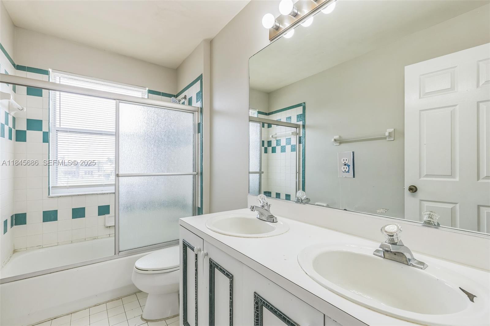 18091 Southwest 22nd Street Miramar, FL 33029 - Photo 16 of 41 a bathroom with a sink toilet and shower