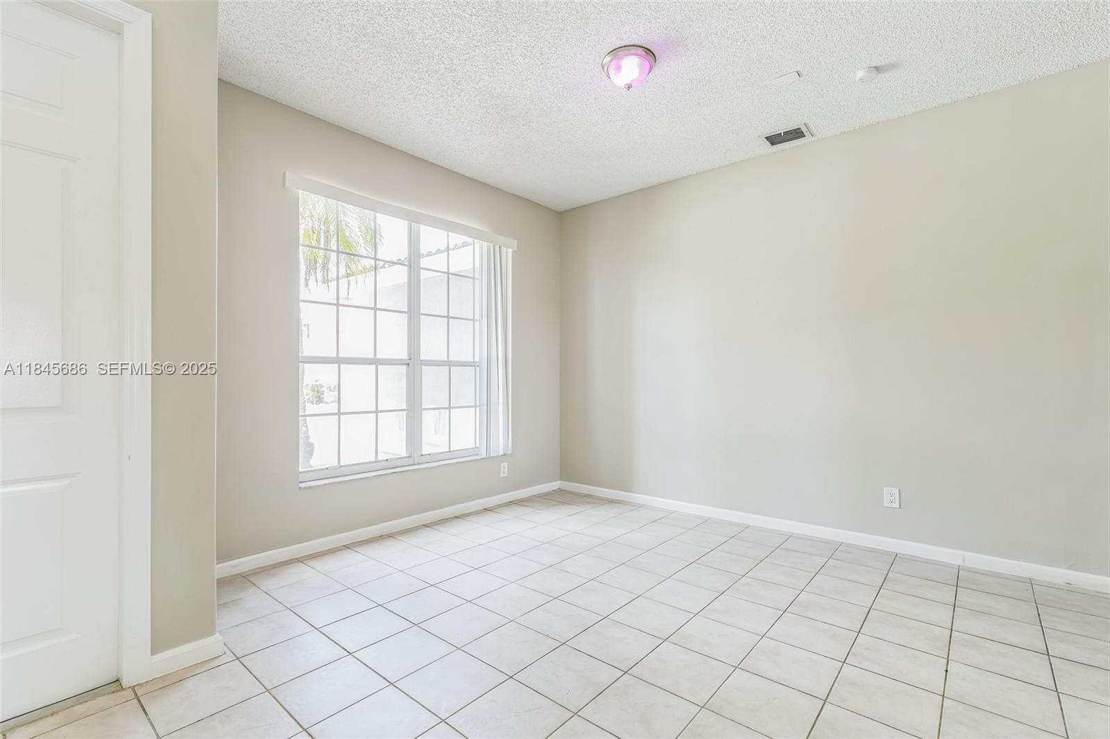 18091 Southwest 22nd Street Miramar, FL 33029 - Photo 23 of 41 an empty room with windows