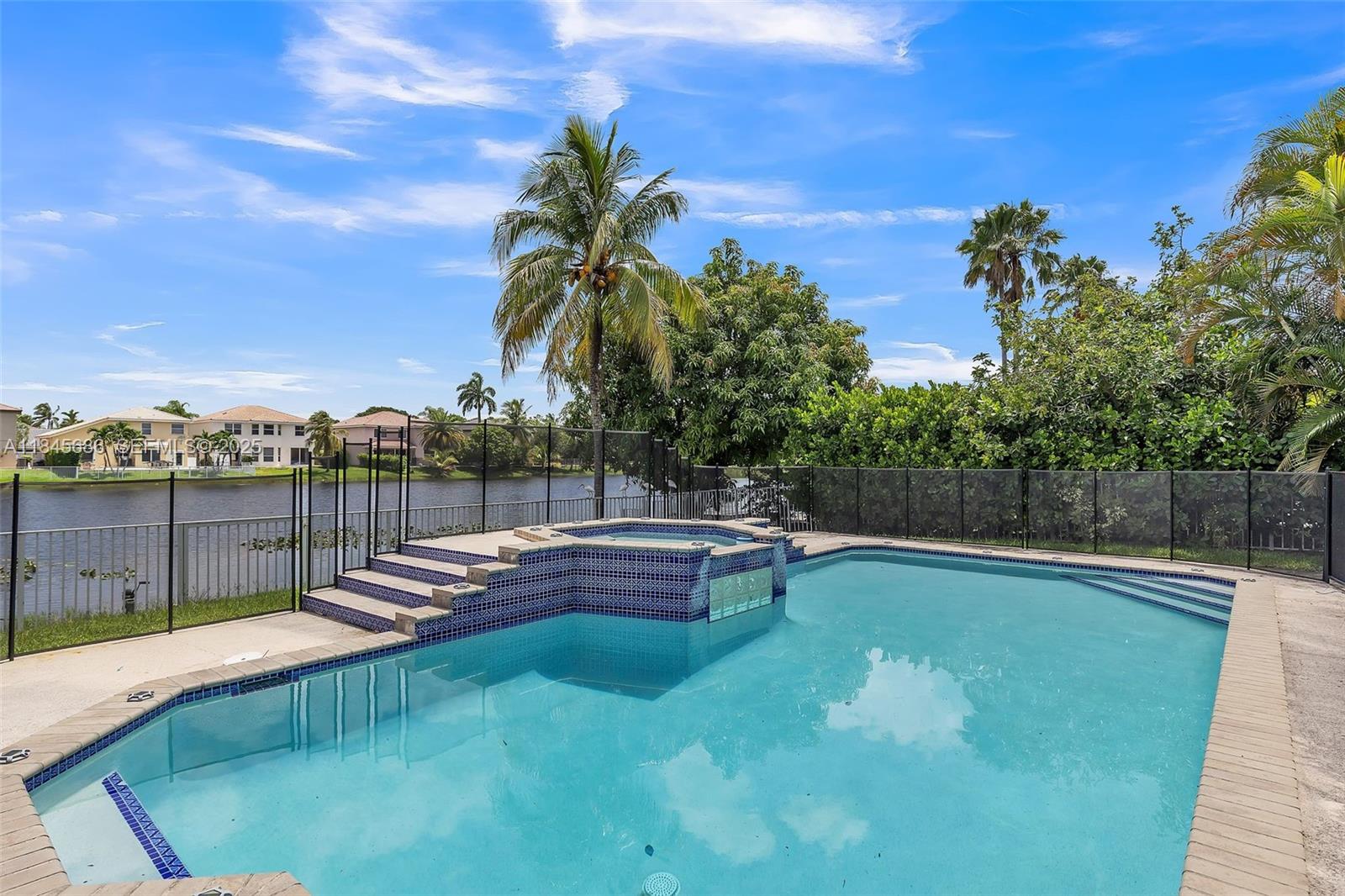 18091 Southwest 22nd Street Miramar, FL 33029 - Photo 39 of 41 a view of a swimming pool with a patio