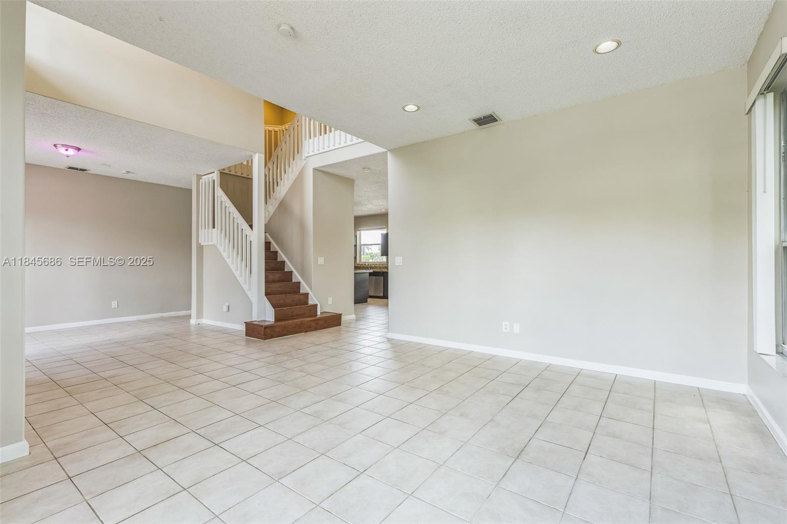 18091 Southwest 22nd Street Miramar, FL 33029 - Photo 5 of 41 a view of an empty room with stairs