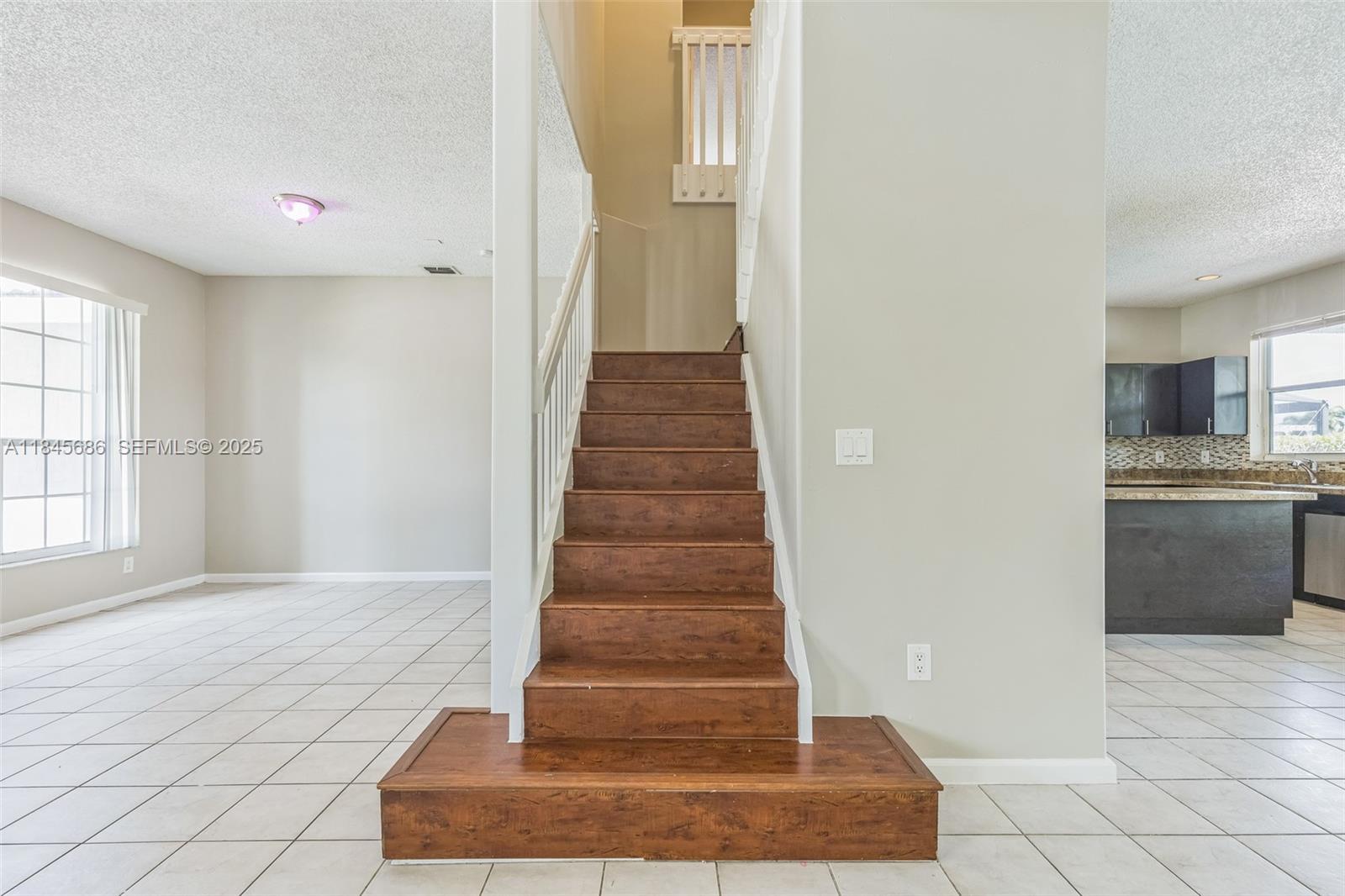 18091 Southwest 22nd Street Miramar, FL 33029 - Photo 6 of 41 a view of entryway and hall with wooden floor