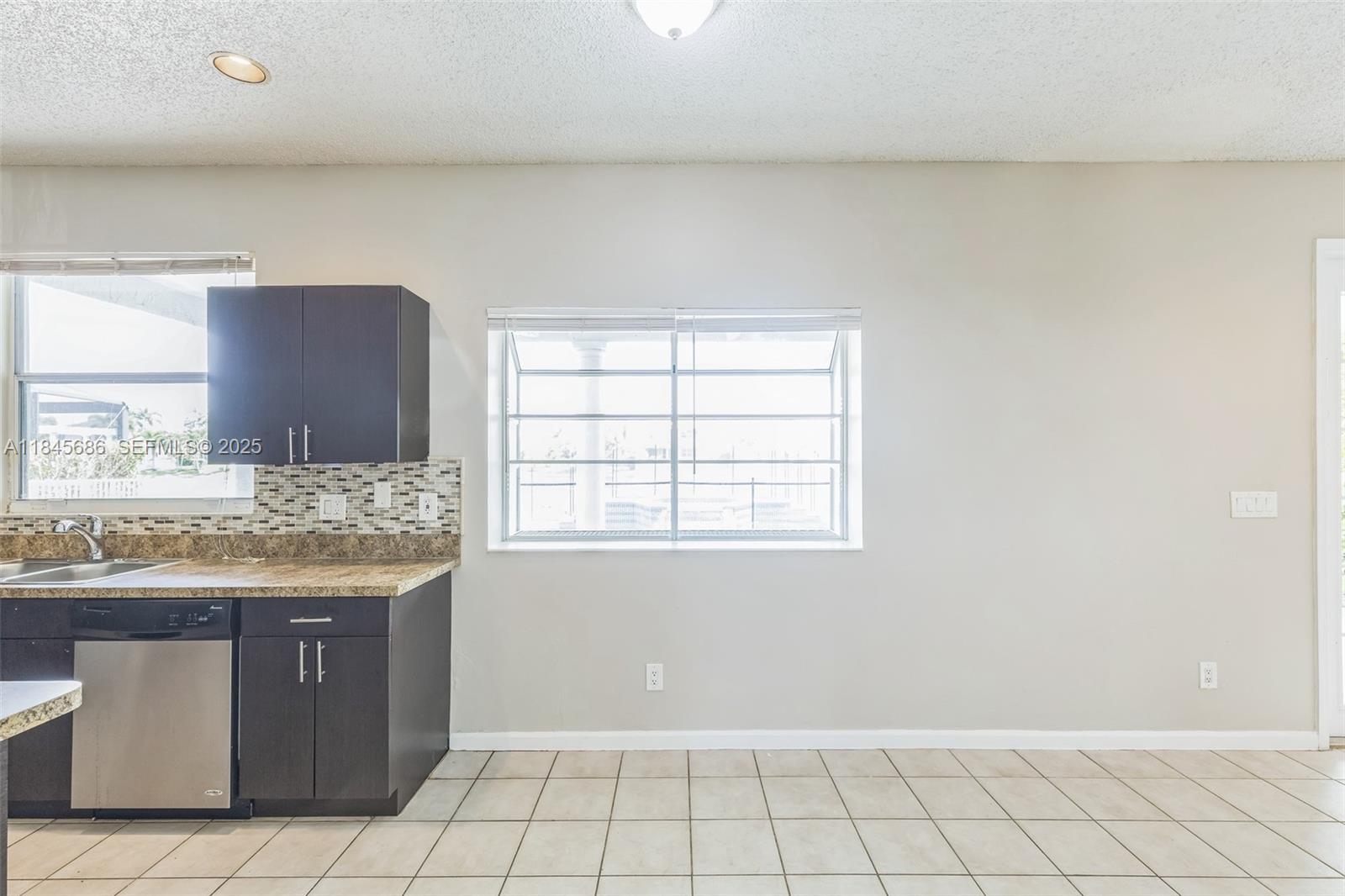 18091 Southwest 22nd Street Miramar, FL 33029 - Photo 8 of 41 a room with a sink and cabinets