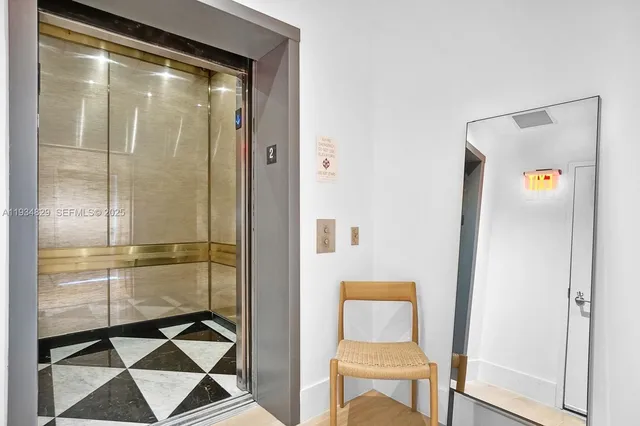 a bathroom with a shower and a mirror