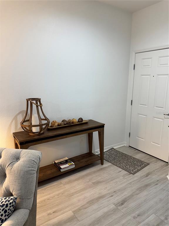 9122 Southwest 70th Loop Ocala, FL 34481 - Photo 12 of 31 a view of a livingroom with furniture and wooden floor