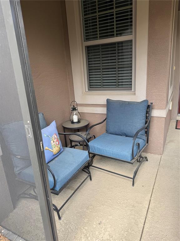 9122 Southwest 70th Loop Ocala, FL 34481 - Photo 16 of 31 a living room with furniture and a window