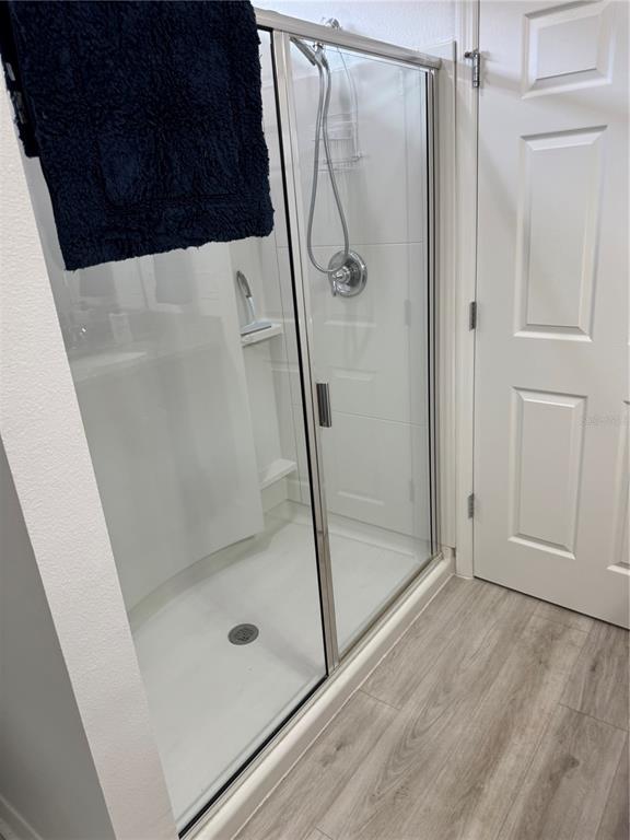 9122 Southwest 70th Loop Ocala, FL 34481 - Photo 18 of 31 a bathroom with a glass shower door