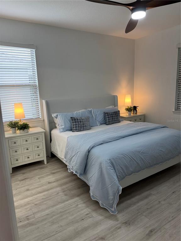 9122 Southwest 70th Loop Ocala, FL 34481 - Photo 24 of 31 a bedroom with a bed and a window