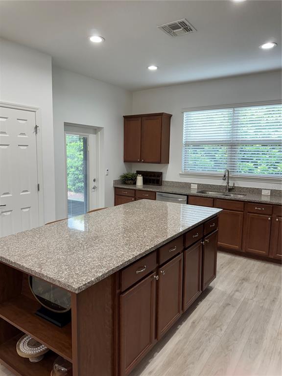 9122 Southwest 70th Loop Ocala, FL 34481 - Photo 25 of 31 a kitchen with a stove sink and cabinets