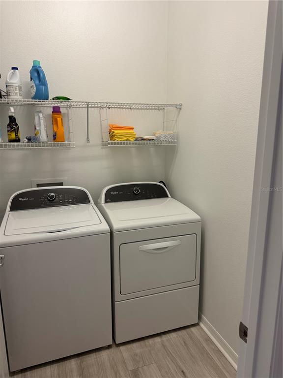9122 Southwest 70th Loop Ocala, FL 34481 - Photo 28 of 31 a utility room with dryer and washer