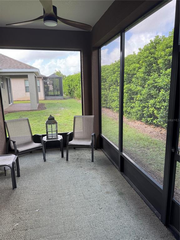 9122 Southwest 70th Loop Ocala, FL 34481 - Photo 29 of 31 a living room with furniture and a large window