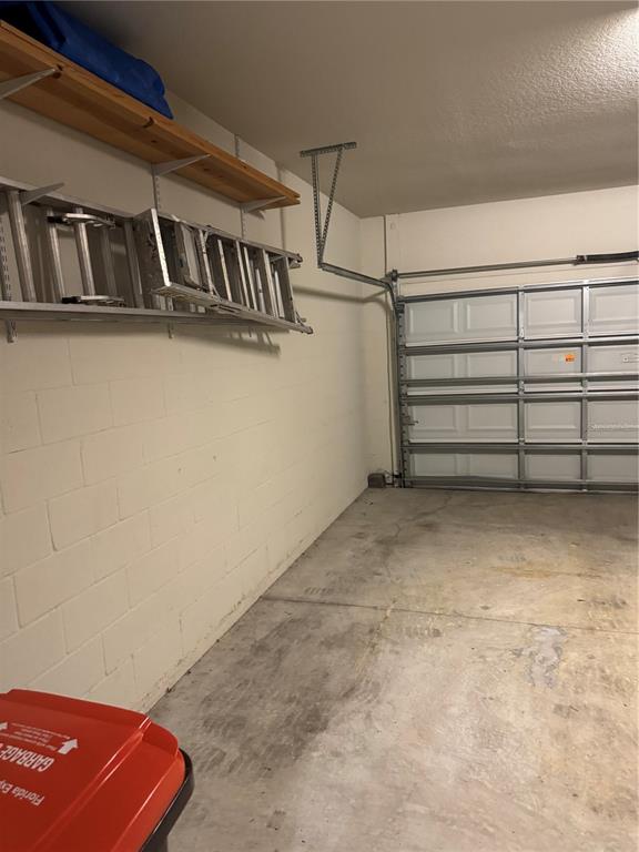 9122 Southwest 70th Loop Ocala, FL 34481 - Photo 4 of 31 a view of a room with racks on the wall