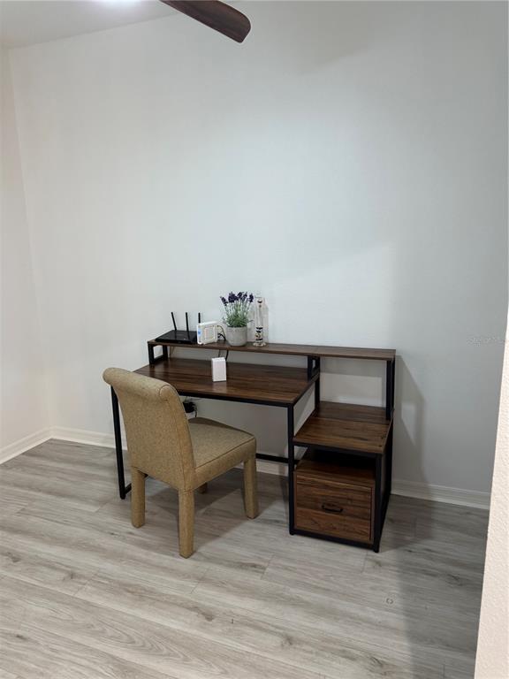 9122 Southwest 70th Loop Ocala, FL 34481 - Photo 7 of 31 a dining room with furniture and wooden floor