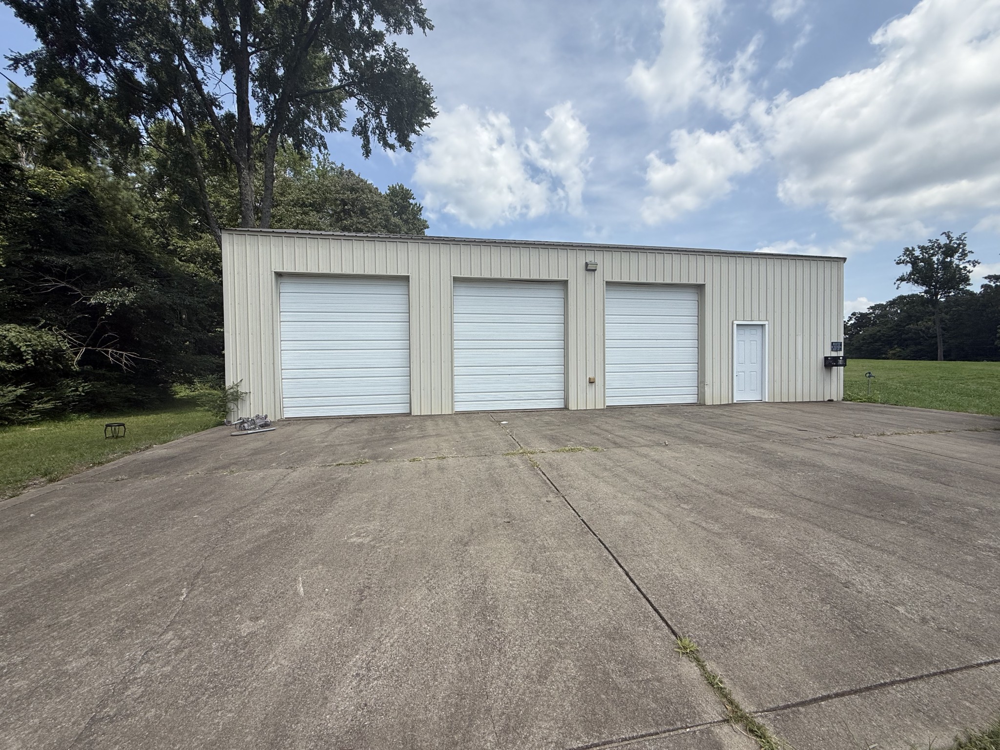 256 Shepherd Hollow Road Indian Mound, TN 37079 - Photo 27 of 29 a view of a house with a yard and garage