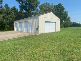 256 Shepherd Hollow Road Indian Mound, TN 37079 - Photo 9 of 29 a view of a house with backyard and garden
