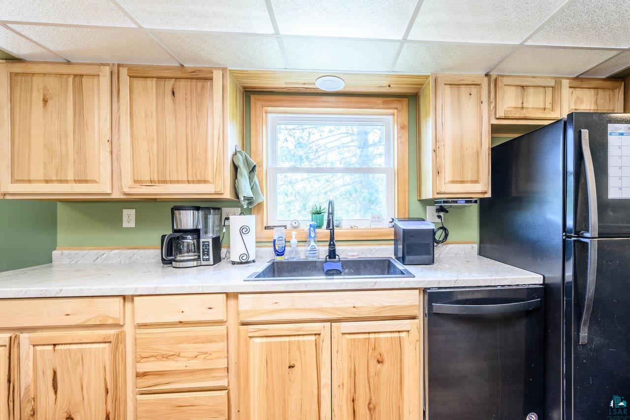 2581 O'Rourke Road Hibbing, MN 55746 - Photo 9 of 61 Natural wood cabinetry with coordinating trim around the window