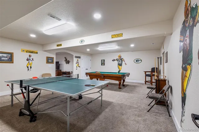 a room with furniture and pool table