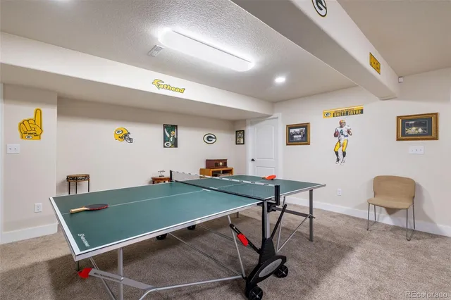 a room with furniture and pool table