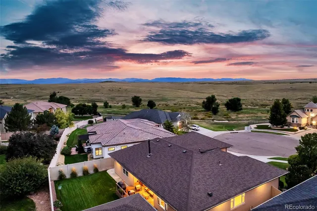 a view of a swimming pool and lounge chairs