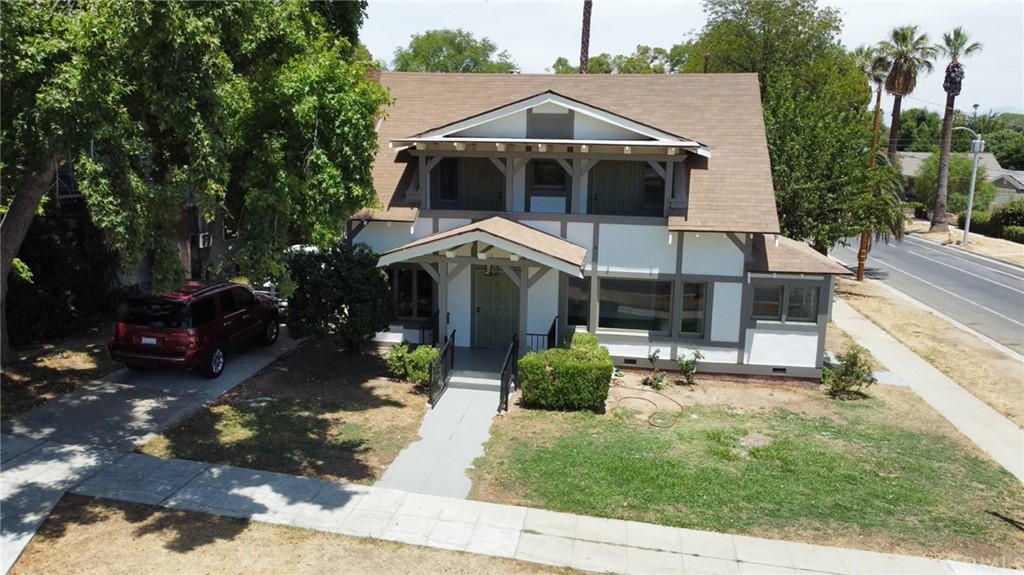 4405 12th Street Riverside, CA 92501 - Photo 1 of 1 a front view of a house with a yard