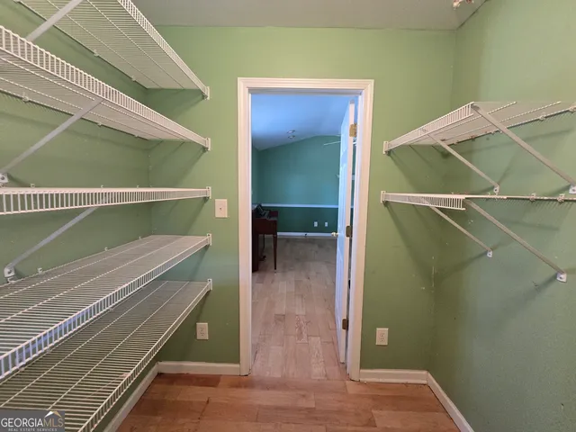 a view of a livingroom with furniture ceiling fan and window