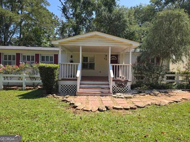 a view of a door and wooden floor