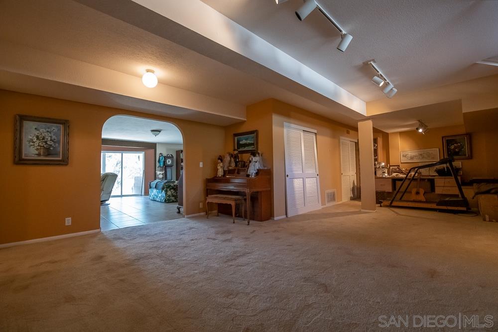 15330 Markar Road Poway, CA 92064 - Photo 21 of 24 This is the great room downstairs that also has 2 more bedrooms around it.