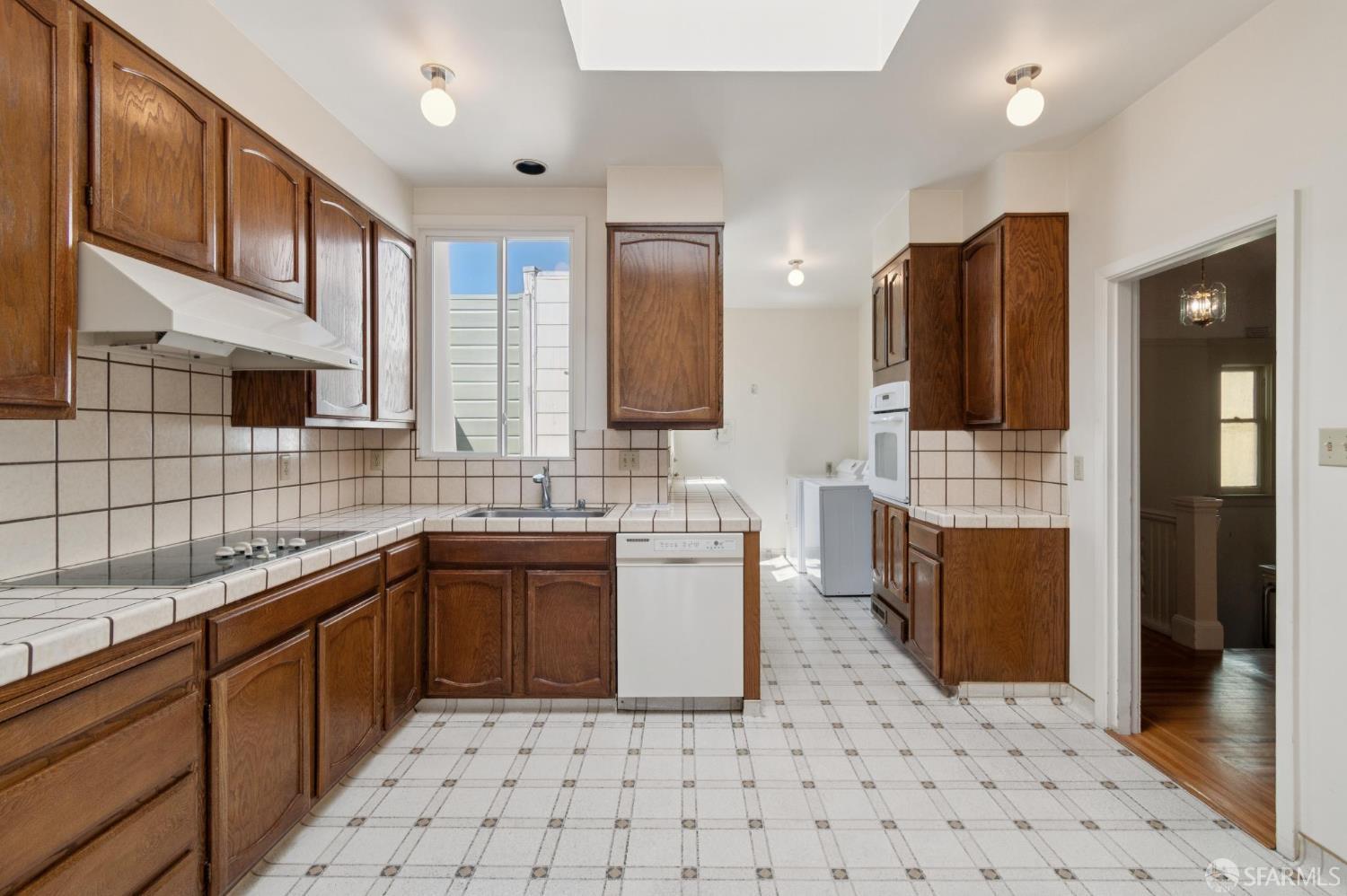 1374-1376 Chestnut Street San Francisco, CA 94123 - Photo 4 of 16 a kitchen with a sink a stove and refrigerator
