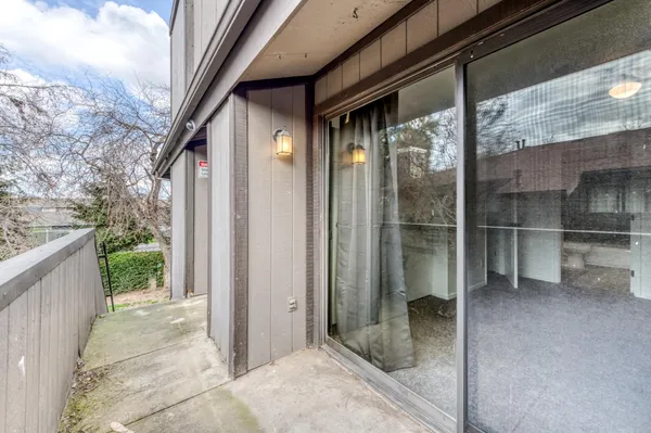 a view of a glass door of the house