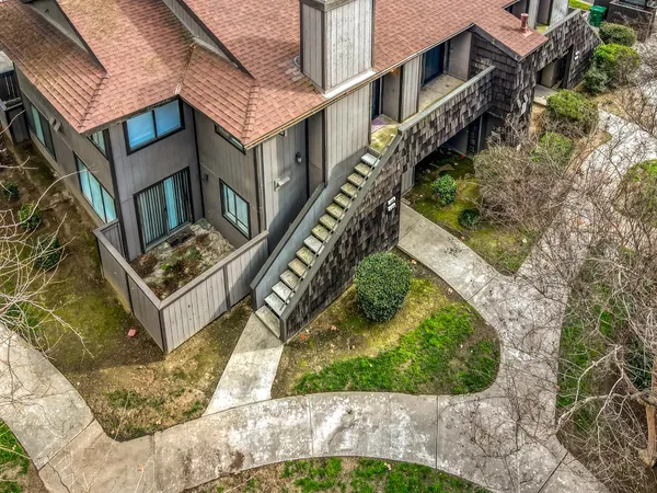 a aerial view of a house with a yard