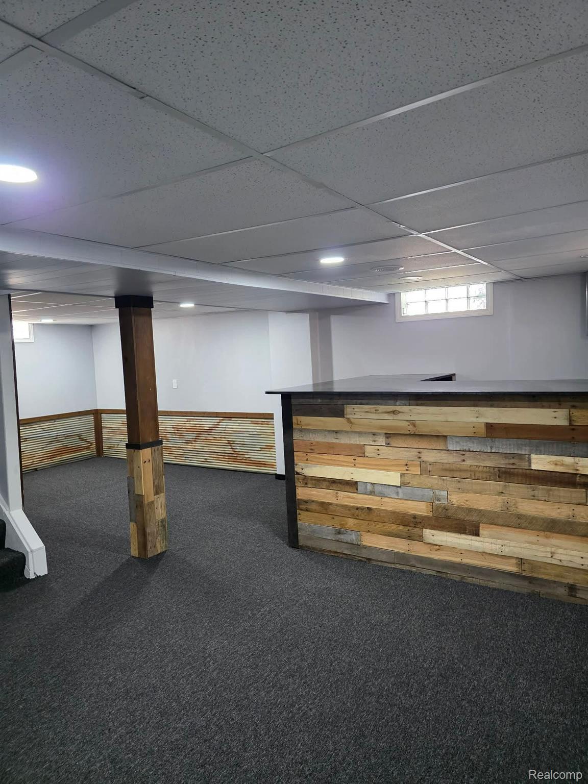 29571 Kelly Road Roseville, MI 48066 - Photo 17 of 27 Basement with a paneled ceiling and carpet