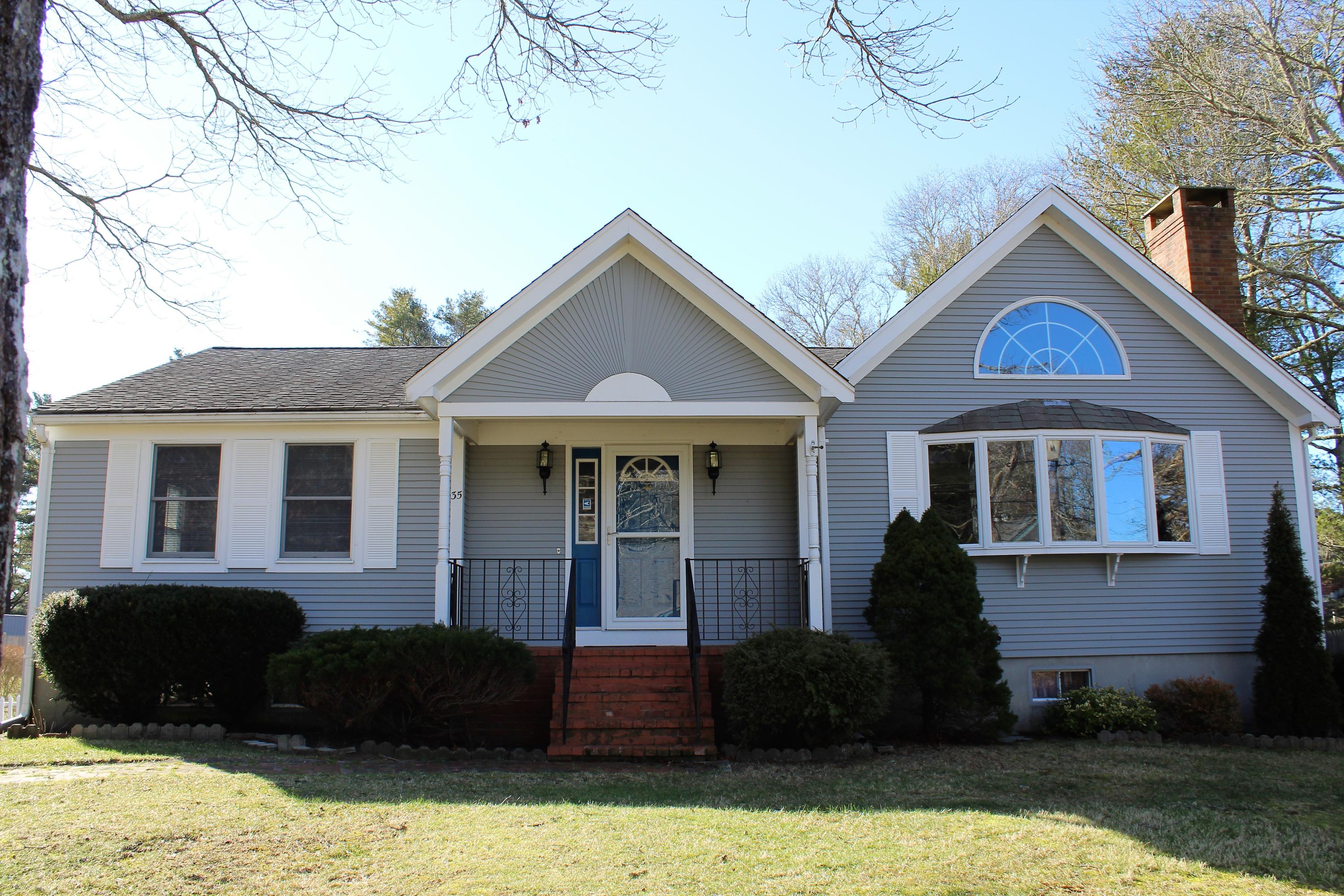a front view of a house with a yard
