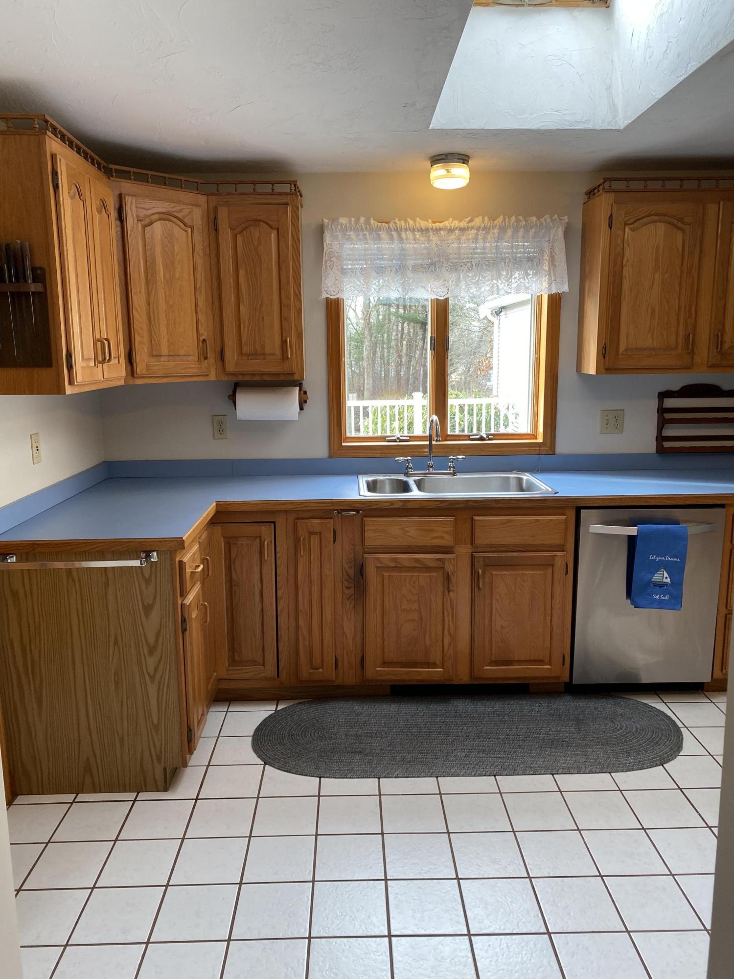 35 Catskill Road Buzzards Bay, MA 02532 - Photo 12 of 43 a kitchen with a sink a counter space and cabinets