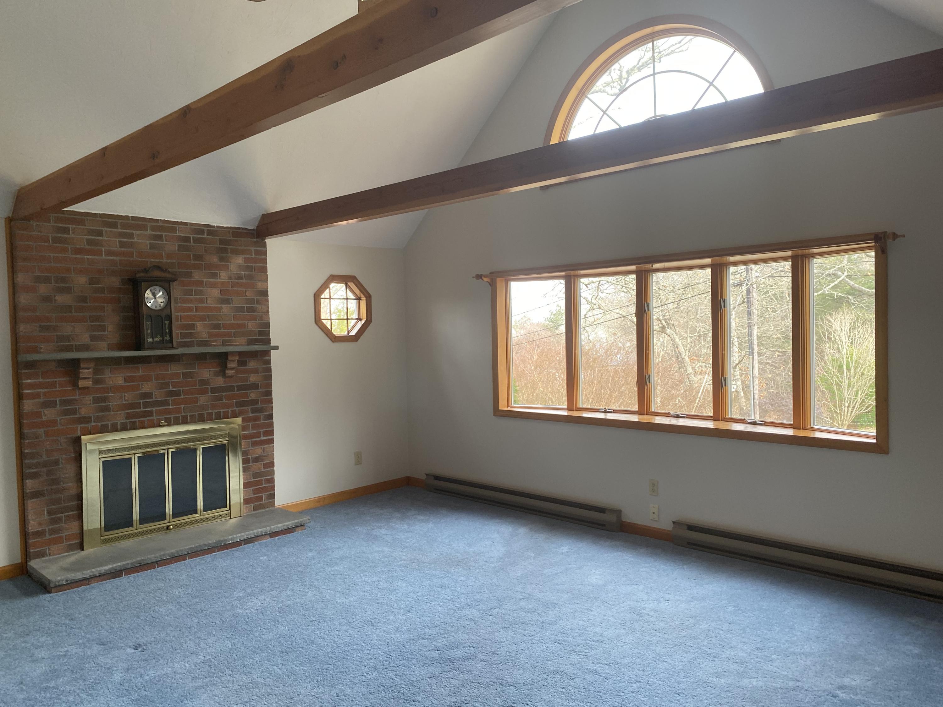 35 Catskill Road Buzzards Bay, MA 02532 - Photo 18 of 43 an empty room with a fireplace