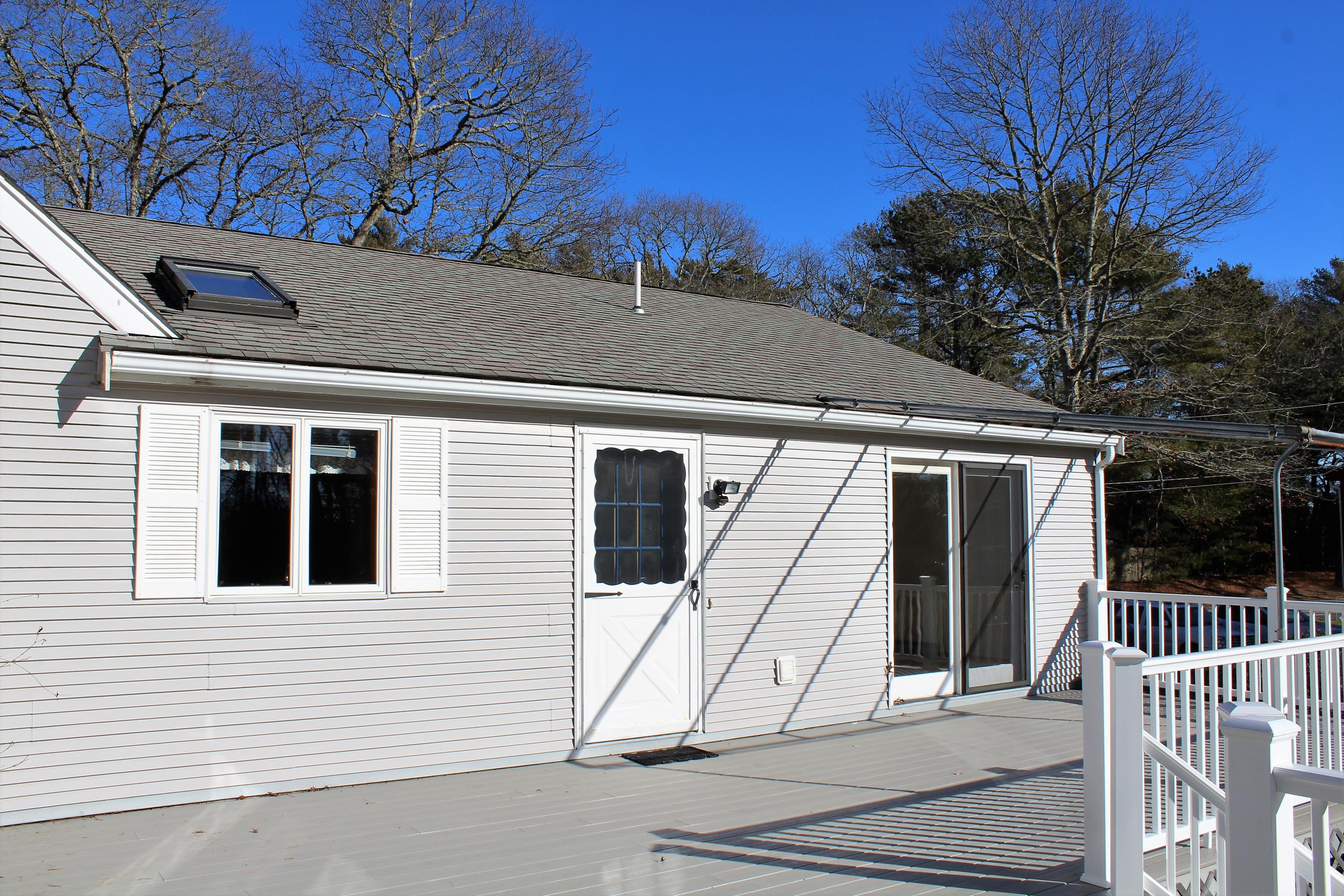 35 Catskill Road Buzzards Bay, MA 02532 - Photo 30 of 43 a view of a house with a small deck