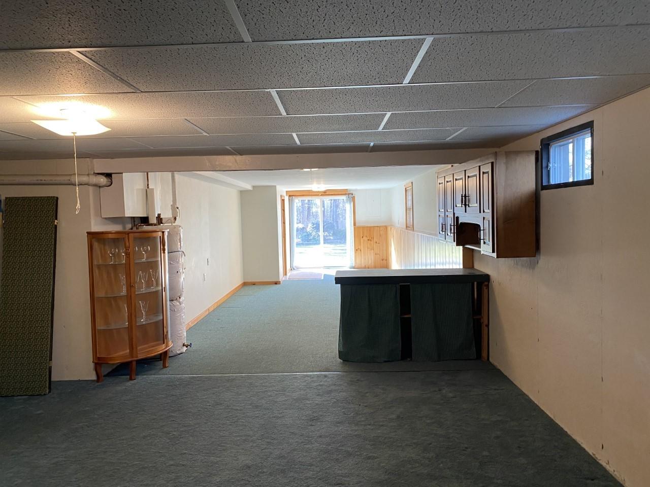35 Catskill Road Buzzards Bay, MA 02532 - Photo 35 of 43 a living room with furniture and a flat screen tv