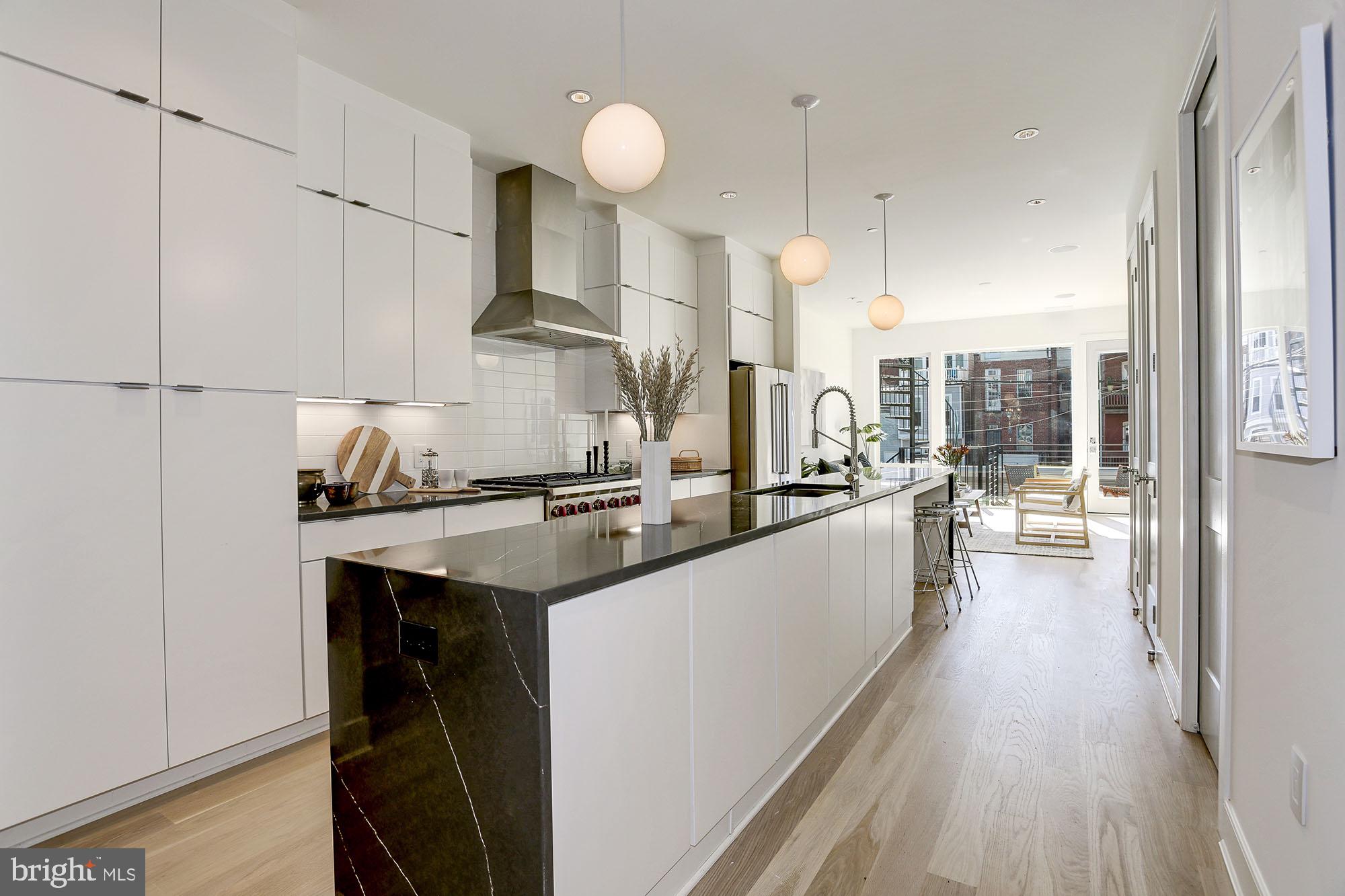 1134 Columbia Road Northwest, Unit 1 Washington, DC 20009 - Photo 5 of 26 Over-sized waterfall island