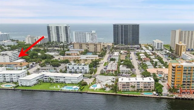 a view of a swimming pool with a lounge chair