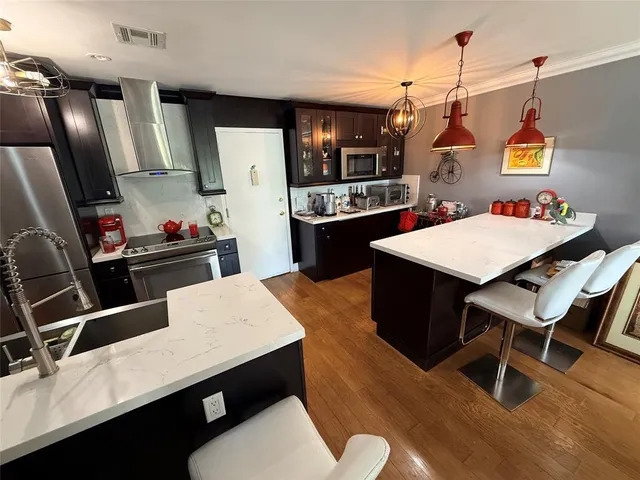 a bed room with furniture and a flat screen tv