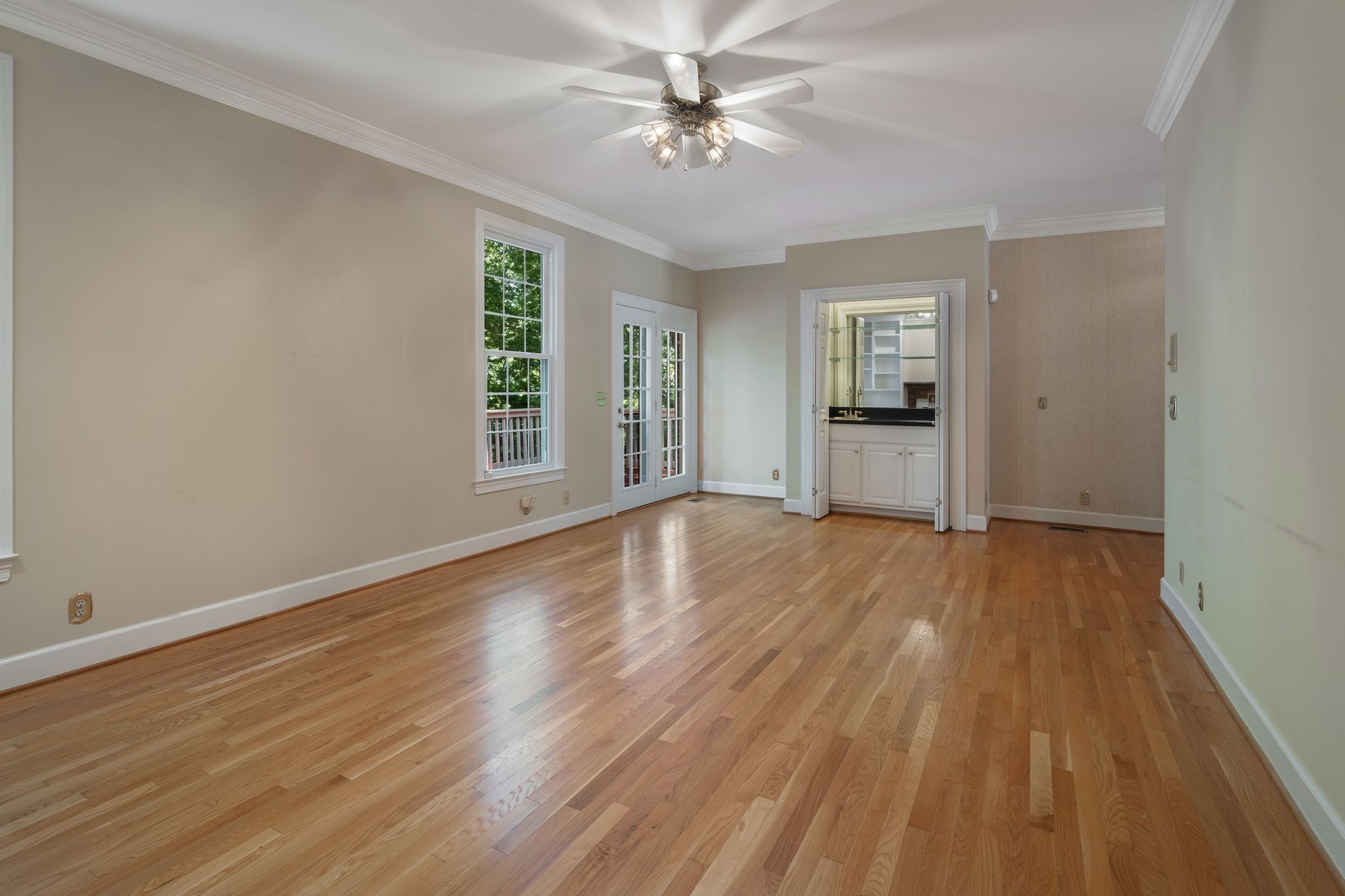 709 Heather Spring Brentwood, TN 37027 - Photo 17 of 43 a view of empty room with wooden floor and fan