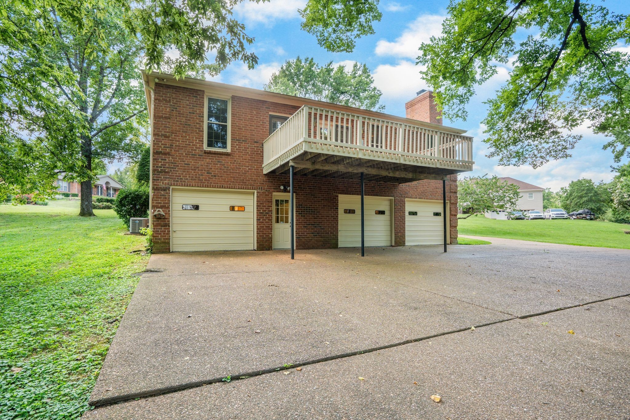 709 Heather Spring Brentwood, TN 37027 - Photo 40 of 43 a view of a house with a backyard and a garage