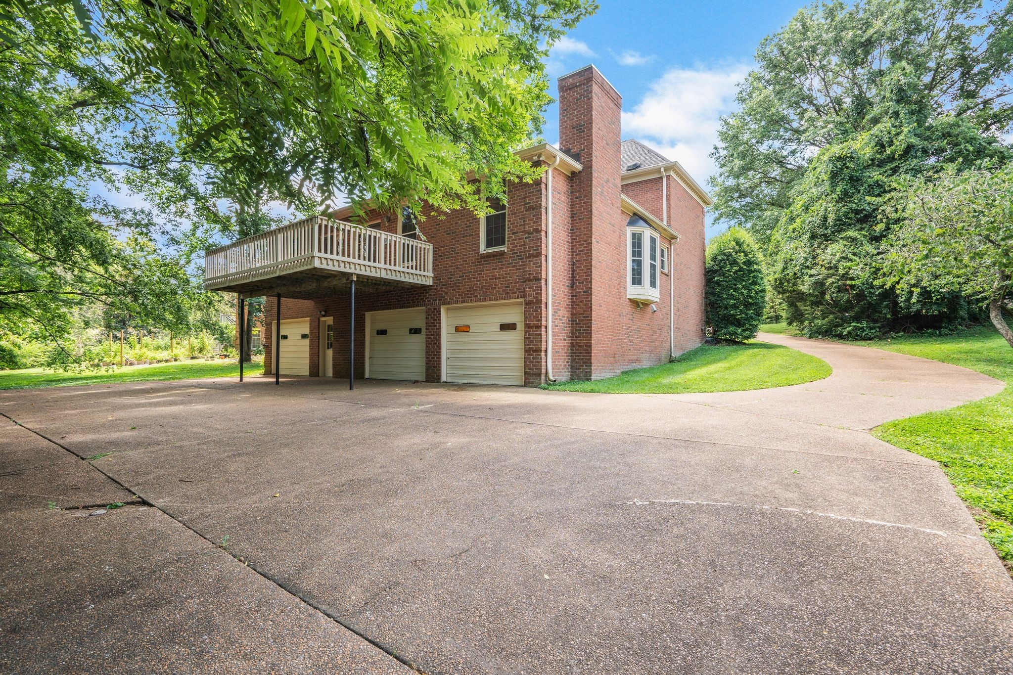 709 Heather Spring Brentwood, TN 37027 - Photo 41 of 43 a view of a house with a yard and large tree