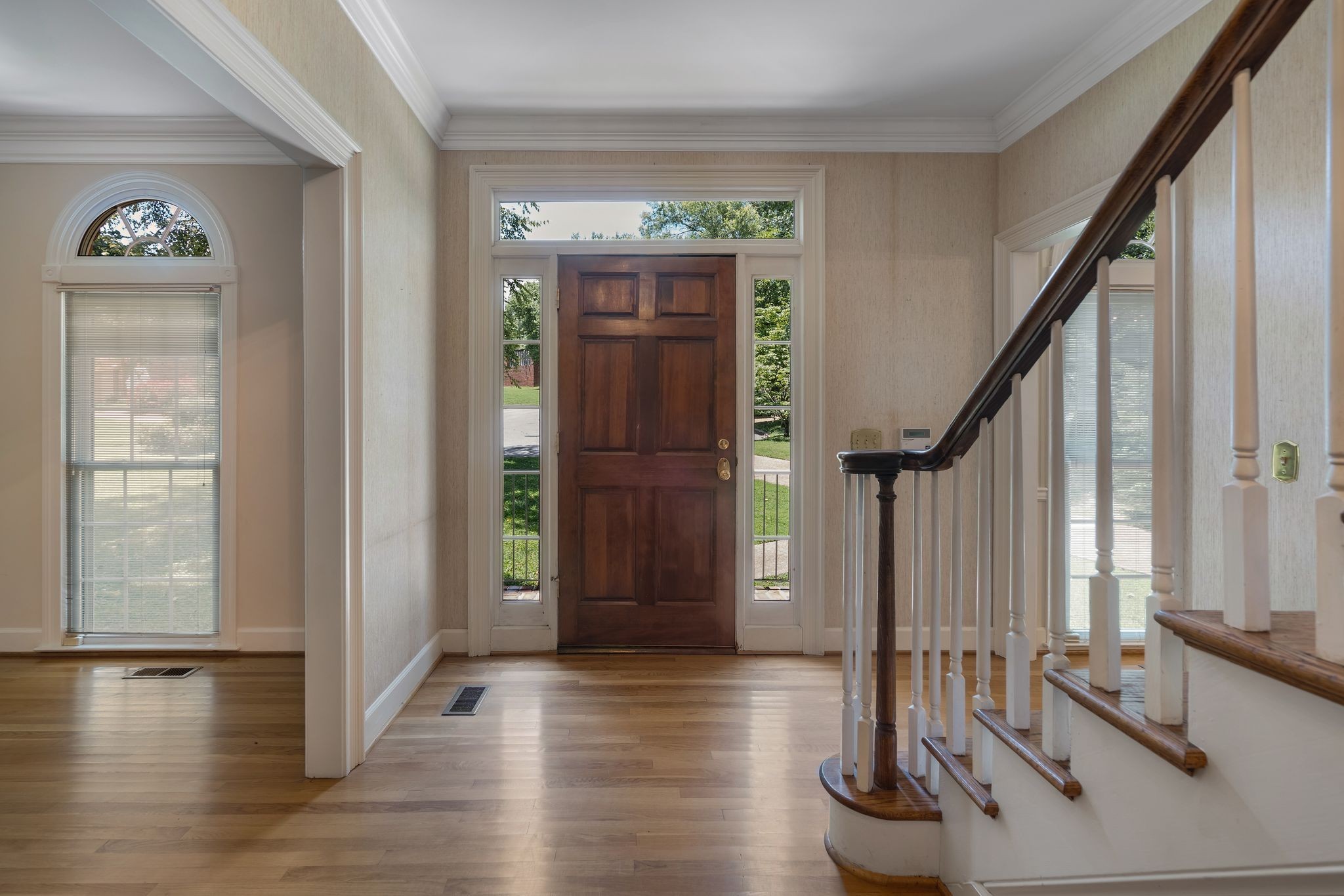 709 Heather Spring Brentwood, TN 37027 - Photo 6 of 43 a view of front door with hallway and wooden floor