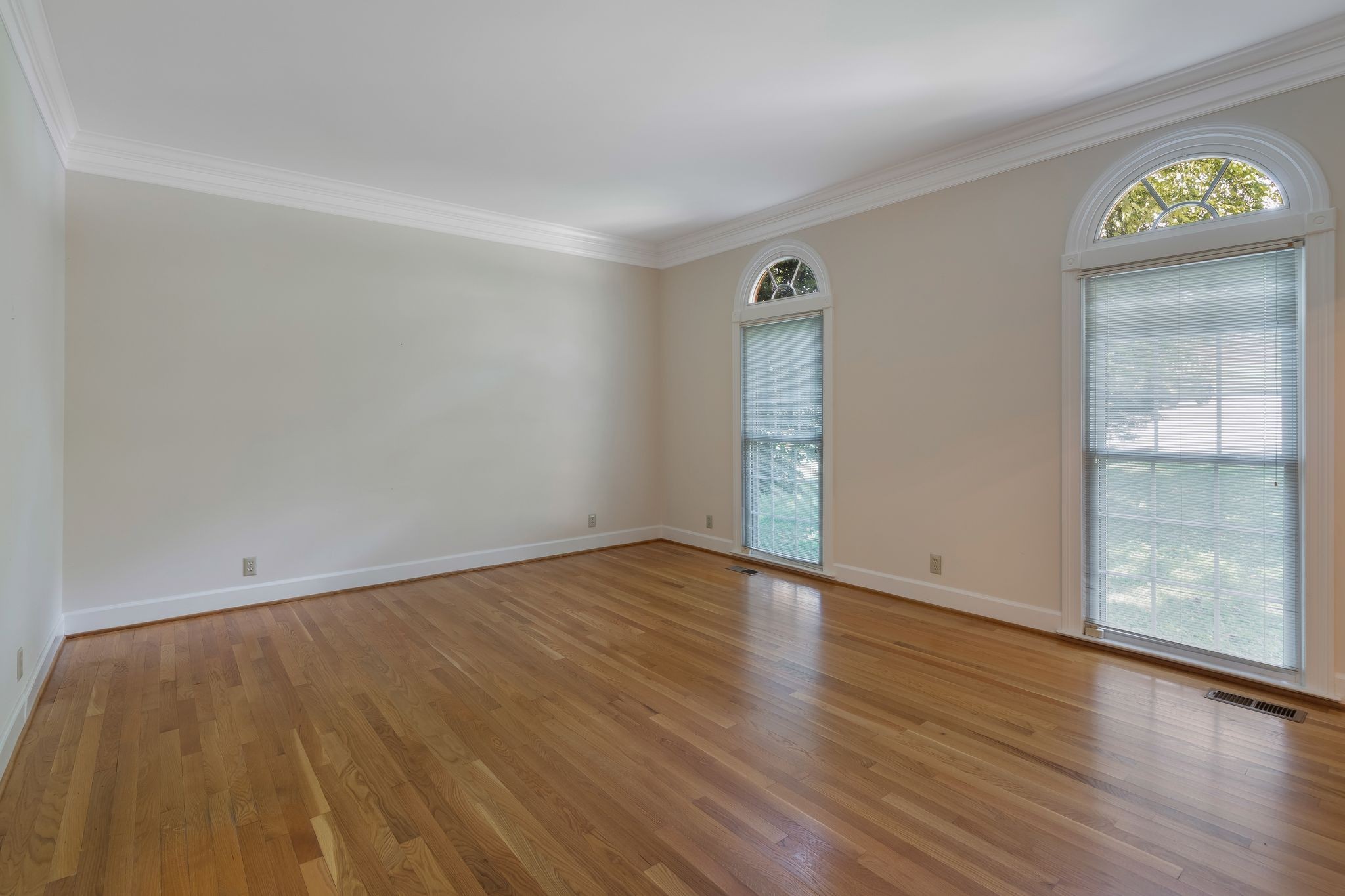 709 Heather Spring Brentwood, TN 37027 - Photo 7 of 43 a view of an empty room with window and wooden floor