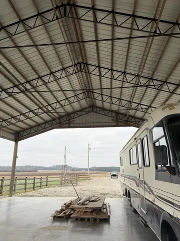 a view of sitting area with swimming pool and furniture