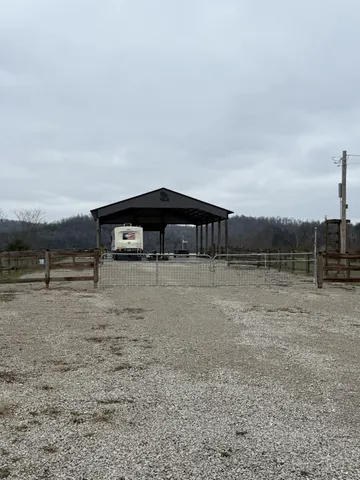 a front view of a house with yard and mountain view